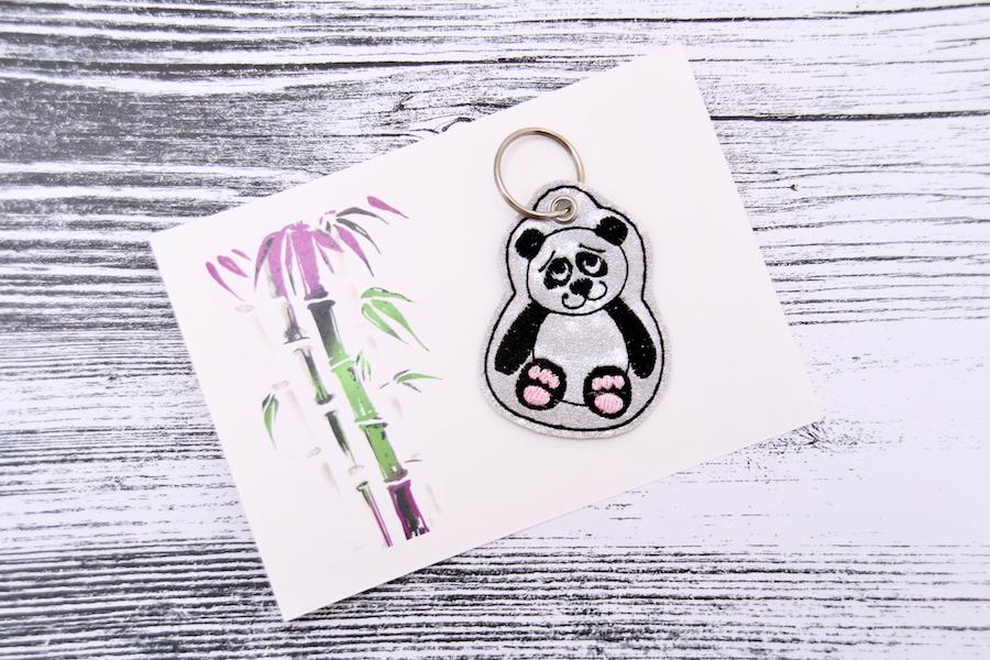 Sale Schlüsselanhänger Panda in silber/ schwarz Glitzer